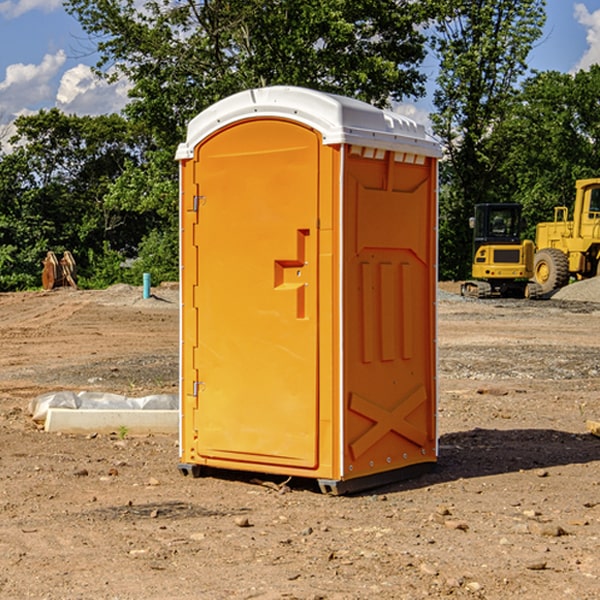 what is the cost difference between standard and deluxe portable restroom rentals in Whitewater